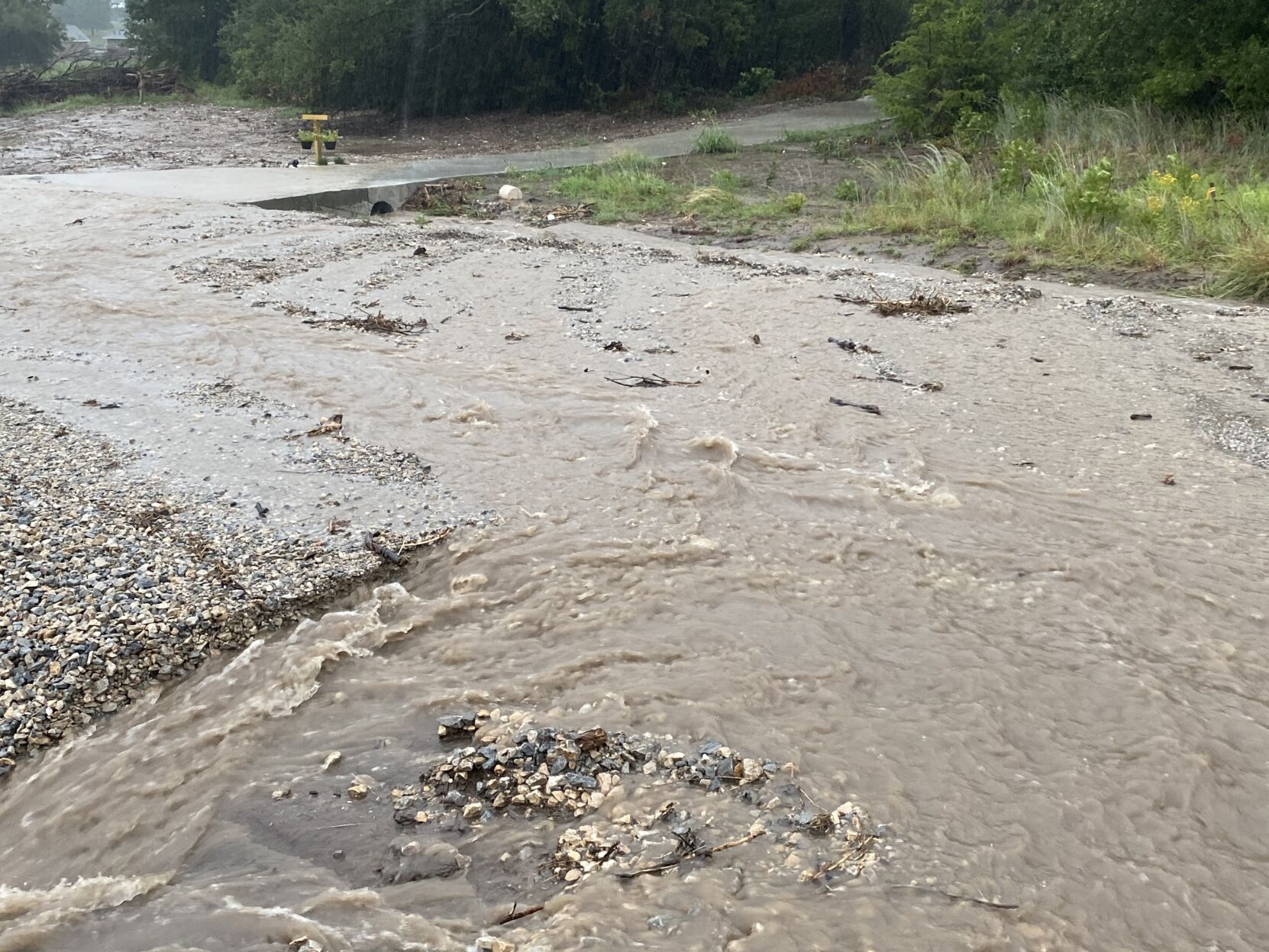 Water running over road
